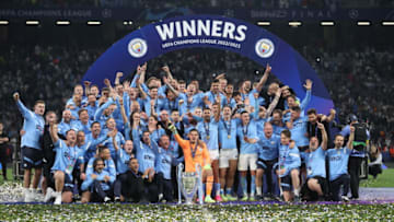 Manchester City players pose with the Champions League trophy after the team's victory in the Champions League final match against Inter at Ataturk Olympic Stadium on June 11, 2023 in Istanbul,Turkiye. (Photo by Berk Ozkan/Anadolu Agency via Getty Images)