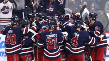 Nov 13, 2021; Winnipeg, Manitoba, CAN; Winnipeg Jets players celebrate their victory against the Los Angeles Kings at Canada Life Centre. Mandatory Credit: James Carey Lauder-USA TODAY Sports