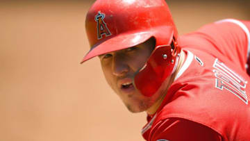 OAKLAND, CA - JUNE 16: Mike Trout #27 of the Los Angeles Angels of Anaheim looks on from the dugout against the Oakland Athletics in the top of the first inning at the Oakland Alameda Coliseum on June 16, 2018 in Oakland, California. (Photo by Thearon W. Henderson/Getty Images)