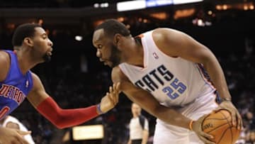 Feb 19, 2014; Charlotte, NC, USA; Charlotte Bobcats center Al Jefferson (25) looks to drive past Detroit Pistons center Andre Drummond (0) during the second half of the game at Time Warner Cable Arena. Bobcats win 116-98. Mandatory Credit: Sam Sharpe-USA TODAY Sports