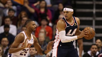 PHOENIX, ARIZONA - DECEMBER 10: Tobias Harris #34 of the LA Clippers handles the ball against Mikal Bridges #25 of the Phoenix Suns during the NBA game at Talking Stick Resort Arena on December 10, 2018 in Phoenix, Arizona. The Clippers defeated the Suns 123-119 in overtime. NOTE TO USER: User expressly acknowledges and agrees that, by downloading and or using this photograph, User is consenting to the terms and conditions of the Getty Images License Agreement. (Photo by Christian Petersen/Getty Images)