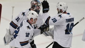 Feb 9, 2016; Chicago, IL, USA; San Jose Sharks goalie Martin Jones (31), center Joe Thornton (19) and center Patrick Marleau (12) celebrate their win against the Chicago Blackhawks at the United Center. Mandatory Credit: The Sharks won 2-0. David Banks-USA TODAY Sports
