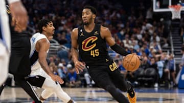 Apr 4, 2023; Orlando, Florida, USA; Cleveland Cavaliers guard Donovan Mitchell (45) dribbles the ball against the Orlando Magic in the second quarter at Amway Center. Mandatory Credit: Jeremy Reper-USA TODAY Sports