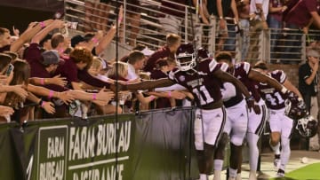 Sep 11, 2021; Starkville, Mississippi, USA; Mississippi State Bulldogs players celebrate with fans after the game against the North Carolina State Wolfpack at Davis Wade Stadium at Scott Field. Mandatory Credit: Matt Bush-USA TODAY Sports