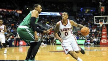 Apr 9, 2014; Atlanta, GA, USA; Atlanta Hawks guard Jeff Teague (0) drives to the basket past Boston Celtics forward Jeff Green (8) in the second half at Philips Arena. The Hawks won 105-97. Mandatory Credit: Daniel Shirey-USA TODAY Sports