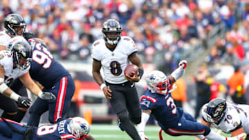 FOXBOROUGH, MASSACHUSETTS - SEPTEMBER 25: Quarterback Lamar Jackson #8 of the Baltimore Ravens runs the ball during the second half against the New England Patriots at Gillette Stadium on September 25, 2022 in Foxborough, Massachusetts. (Photo by Adam Glanzman/Getty Images)