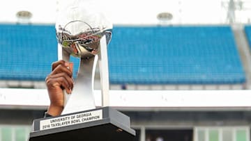 JACKSONVILLE, FL - JANUARY 02: Head coach Bryan McClendon of the Georgia Bulldogs raises the championship trophy after the TaxSlayer Bowl game against the Penn State Nittany Lions at EverBank Field between the Georgia Bulldogs and the Penn State Nittany Lions on January 2, 2016 in Jacksonville, Florida. (Photo by Rob Foldy/Getty Images)