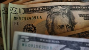 SAN ANSELMO, CA - AUGUST 29: In this Photo Illustration, Twenty and five dollar bills are displayed on August 29, 2017 in San Anselmo, California. The dollar fell to a two and a half year low to 91.77 Tuesday following the latest missile launch by North Korea. The U.S. dollar index has slipped over 10% since the inauguration of U.S. President Donald Trump. (Photo Illustration by Justin Sullivan/Getty Images)