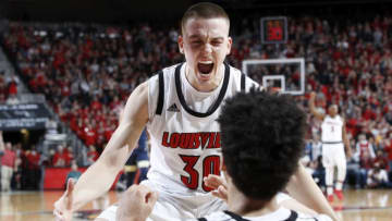LOUISVILLE, KY - JANUARY 26: Ryan McMahon #30 and Jordan Nwora #33 of the Louisville Cardinals celebrate against the Pittsburgh Panthers in the second half of the game at KFC YUM! Center on January 26, 2019 in Louisville, Kentucky. Louisville won 66-51. (Photo by Joe Robbins/Getty Images)