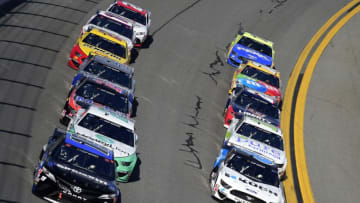 DAYTONA BEACH, FLORIDA - FEBRUARY 09: Martin Truex Jr., driver of the #19 SiriusXM Toyota, and Ryan Newman, driver of the #6 Koch Industries Ford, lead the field during the NASCAR Cup Series Busch Clash at Daytona International Speedway on February 09, 2020 in Daytona Beach, Florida. (Photo by Jared C. Tilton/Getty Images)