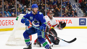 VANCOUVER, BC - DECEMBER 12: Vancouver Canucks Center J.T. Miller (9) skates past Carolina Hurricanes Goalie Petr Mrazek (34) during their NHL game at Rogers Arena on December 12, 2019 in Vancouver, British Columbia, Canada. (Photo by Derek Cain/Icon Sportswire via Getty Images)