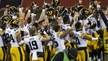 Dec 5, 2020; Champaign, Illinois, USA; The Iowa Hawkeyes celebrate after defeating the Illinois Fighting Illini after the second half at Memorial Stadium. Mandatory Credit: Patrick Gorski-USA TODAY Sports