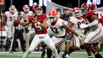 Alabama Crimson Tide quarterback Bryce Young (9) attempts a pass against Georgia Bulldogs linebacker Robert Beal Jr. (33) during the second quarter of the SEC championship game at Mercedes-Benz Stadium. Mandatory Credit: Jason Getz-USA TODAY Sports