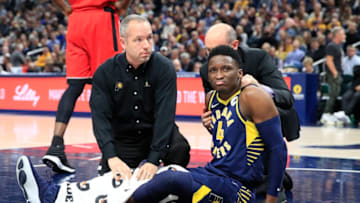INDIANAPOLIS, INDIANA - JANUARY 23: Victor Oladipo #4 of the Indiana Pacers is attended to by medical staff after being injured in the second quarter of the game against the Toronto Raptors at Bankers Life Fieldhouse on January 23, 2019 in Indianapolis, Indiana. (Photo by Andy Lyons/Getty Images)