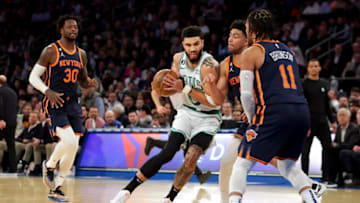 Feb 27, 2023; New York, New York, USA; Boston Celtics forward Jayson Tatum (0) drives to the basket against New York Knicks guards Quentin Grimes (6) and Jalen Brunson (11) and forward Julius Randle (30) during the first quarter at Madison Square Garden. Mandatory Credit: Brad Penner-USA TODAY Sports