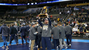 PITTSBURGH, PA - MARCH 23: Bo Nickal of the Penn State Nittany Lions holds the trophy as he celebrates with teammates after winning the team title of the NCAA Wrestling Championships on March 23, 2019 at PPG Paints Arena in Pittsburgh, Pennsylvania. (Photo by Hunter Martin/NCAA Photos via Getty Images)
