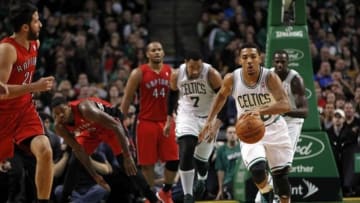 Jan 15, 2014; Boston, MA, USA; Boston Celtics point guard Phil Pressey (26) controls the ball on a fast break during the second quarter against the Toronto Raptors at TD Garden. Mandatory Credit: Greg M. Cooper-USA TODAY Sports