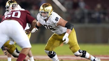Nov 27, 2021; Stanford, California, USA; Notre Dame Fighting Irish offensive lineman Joe Alt (76) blocks Stanford Cardinal defensive tackle Dalyn Wade-Perry (50) during the fourth quarter at Stanford Stadium. Mandatory Credit: Darren Yamashita-USA TODAY Sports