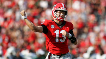 ATHENS, GA - SEPTEMBER 11: Stetson Bennett #13 of the Georgia Bulldogs celebrates after a touchdown throw against the UAB Blazers in the first half at Sanford Stadium on September 11, 2021 in Athens, Georgia. (Photo by Brett Davis/Getty Images)