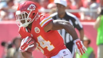 Sep 7, 2014; Kansas City, MO, USA; Kansas City Chiefs running back Knile Davis (34) returns a kick during the second half against the Tennessee Titans at Arrowhead Stadium. The Titans won 26-10. Mandatory Credit: Denny Medley-USA TODAY Sports