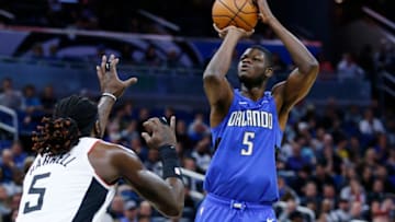 ORLANDO, FLORIDA - JANUARY 26: Mo Bamba #5 of the Orlando Magic shoots a jumper over Montrezl Harrell #5 of the LA Clippers during the second half at Amway Center on January 26, 2020 in Orlando, Florida. NOTE TO USER: User expressly acknowledges and agrees that, by downloading and/or using this photograph, user is consenting to the terms and conditions of the Getty Images License Agreement. (Photo by Michael Reaves/Getty Images)