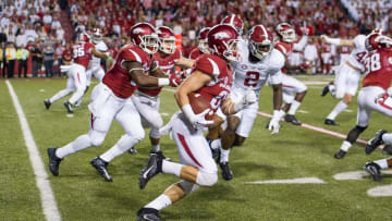 Oct 8, 2016; Fayetteville, AR, USA; Arkansas Razorbacks wide receiver Drew Morgan (middle) returns a kickoff for a long gain during the second quarter against the Alabama Crimson Tide at Donald W. Reynolds Razorback Stadium. Mandatory Credit: Brett Rojo-USA TODAY Sports