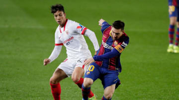 BARCELONA, SPAIN - MARCH 3: (L-R) Oliver Torres of Sevilla FC, Lionel Messi of FC Barcelona during the Spanish Copa del Rey match between FC Barcelona v Sevilla at the Camp Nou on March 3, 2021 in Barcelona Spain (Photo by David S. Bustamante/Soccrates/Getty Images)