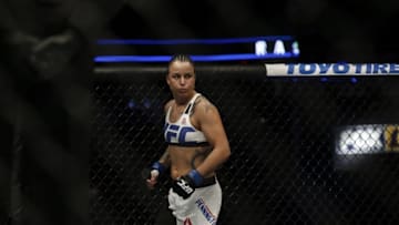 Apr 16, 2016; Tampa, FL, USA; Raquel Pennington (blue gloves) fights Bethe Coreia (red gloves) in the women