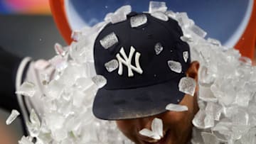 MINNEAPOLIS, MN - JULY 23: A teammate pours ice on Aaron Hicks #31 of the New York Yankees after the game against the Minnesota Twins on July 23, 2019 at Target Field in Minneapolis, Minnesota. The Yankees defeated the Twins 14-12 in ten innings (Photo by Hannah Foslien/Getty Images)