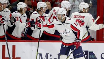 RALEIGH, NC - MARCH 28: Brett Connolly #10 of the Washington Capitals celebrates with teammates after scoring a goal during an NHL game against the Carolina Hurricanes on March 28, 2019 at PNC Arena in Raleigh, North Carolina. (Photo by Gregg Forwerck/NHLI via Getty Images)