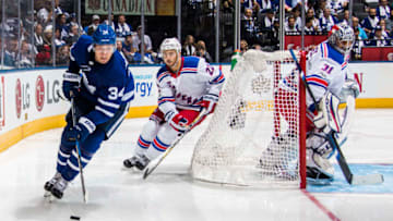 TORONTO, ONTARIO - OCTOBER 7: Auston Matthews #34 of the Toronto Maple Leafs skates past Kevin Shattenkirk #22 and Ondrej Pavelec #31 of the New York Rangers during the second period October 7, 2017 at the Air Canada Centre in Toronto, Ontario, Canada. (Photo by Mark Blinch/NHLI via Getty Images)
