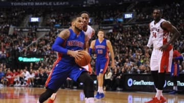 Jan 25, 2015; Toronto, Ontario, CAN; Detroit Pistons guard D.J. Augustin (14) moves under the basket to shoot as Toronto Raptors guard DeMar DeRozan (10) moves to defend in the second quarter at Air Canada Centre. Mandatory Credit: Peter Llewellyn-USA TODAY Sports