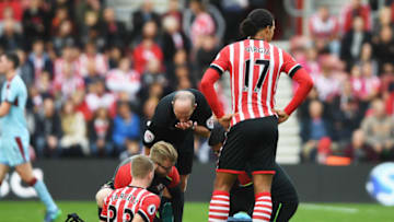SOUTHAMPTON, ENGLAND - OCTOBER 16: Matt Targett of Southampton (33) is givent treatment during the Premier League match between Southampton and Burnley at St Mary's Stadium on October 16, 2016 in Southampton, England. (Photo by Mike Hewitt/Getty Images)