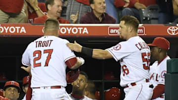 May 18, 2016; Anaheim, CA, USA; Los Angeles Angels center fielder Mike Trout (27) celebrates with right fielder Kole Calhoun (56) after scoring against the Los Angeles Dodgers during the fifth inning at Angel Stadium of Anaheim. Mandatory Credit: Richard Mackson-USA TODAY Sports
