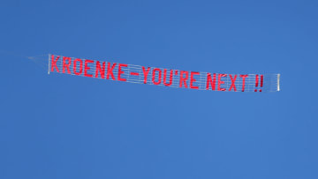 HUDDERSFIELD, ENGLAND - MAY 13: A plane is seen flying a sign reading 'Kroenke - youre next' during the Premier League match between Huddersfield Town and Arsenal at John Smith's Stadium on May 13, 2018 in Huddersfield, England. (Photo by Catherine Ivill/Getty Images)