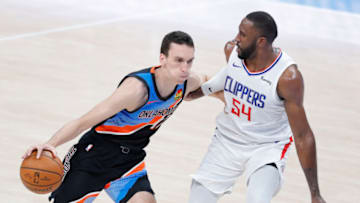 OKC Thunder forward Aleksej Pokusevski (17) drives to the basket as LA Clippers forward Patrick Patterson (54) defends : Alonzo Adams-USA TODAY Sports