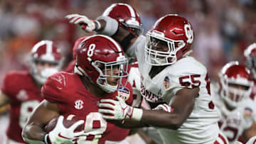 MIAMI, FL - DECEMBER 29: Josh Jacobs #8 of the Alabama Crimson Tide carries the ball against the defense of Kenneth Mann #55 of the Oklahoma Sooners in the fourth quarter during the College Football Playoff Semifinal at the Capital One Orange Bowl against the Oklahoma Sooners at Hard Rock Stadium on December 29, 2018 in Miami, Florida. (Photo by Streeter Lecka/Getty Images)