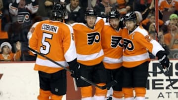 Philadelphia Flyers center Claude Giroux (28) right celebrates his goal with defenseman Braydon Coburn (5) and defenseman Andrej Meszaros (41) against the Minnesota Wild during the second period at Wells Fargo Center. Mandatory Credit: Eric Hartline-USA TODAY Sports