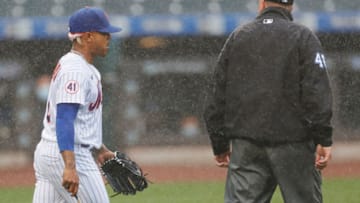 NEW YORK, NEW YORK - APRIL 11: Marcus Stroman #0 of the New York Mets talks with umpire Ron Kulpa #46 while pitching during the first inning against the Miami Marlins at Citi Field on April 11, 2021 in the Queens borough of New York City. (Photo by Sarah Stier/Getty Images)