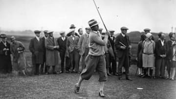13th July 1927: American golfer Bill Mehlhorn follows through on a drive at the fourth tee, during the Open Golf Championship at St Andrews, Fife. The Royal and Ancient golf club at St Andrews was founded in 1754 and recognised as the Governing Authority on the rules of the game in 1897. There are now more than 100 countries and associations affiliated to the famous club. (Photo by Kirby/Topical Press Agency/Getty Images)