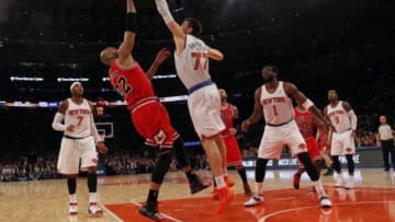 Dec 11, 2013; New York, NY, USA; Chicago Bulls power forward Taj Gibson (22) has his shot blocked by New York Knicks power forward Andrea Bargnani (77) in the first half of NBA game at Madison Square Garden. Mandatory Credit: Noah K. Murray-USA TODAY Sports