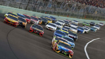 HOMESTEAD, FLORIDA - NOVEMBER 17: Kyle Busch, driver of the #18 M&M's Toyota, leads a pack of cars during the Monster Energy NASCAR Cup Series Ford EcoBoost 400 at Homestead Speedway on November 17, 2019 in Homestead, Florida. (Photo by Brian Lawdermilk/Getty Images)