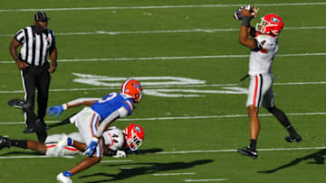 Georgia OLB (40) Nolan Smith intercpts a Florida pass after it was tipped by Georgia DL (44) Travon Walker during second quarter action. The Florida Gators went into the half trailing the Georgia Bulldogs 24 to 0. The Florida Gators were the home team for this years annual Florida vs Georgia college football rivalry game at TIAA Bank field in Jacksonville, Florida Saturday, October 30, 2021. [Bob Self/Florida Times-Union]Jki 103021 Bsfloridageorgi 3