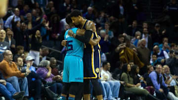Mar 4, 2016; Charlotte, NC, USA; Charlotte Hornets Kemba Walker (15) and Indiana Pacers forward Paul George (13) hug after the game at Time Warner Cable Arena. The Hornets defeated the Pacers 108-101. Mandatory Credit: Jeremy Brevard-USA TODAY Sports