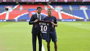 PARIS, FRANCE - AUGUST 04: Neymar poses with his new jersey next to Paris Saint-Germain President Nasser Al-Khelaifi after a press conference on August 4, 2017 in Paris, France. Neymar signed a 5 year contract for 222 Million Euro. (Photo by Aurelien Meunier/Getty Images)