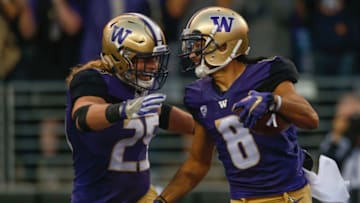 SEATTLE, WA - SEPTEMBER 16: Wide receiver Dante Pettis #8 of the Washington Huskies is congratulated by a teammate after returning a punt for a touchdown against the Fresno State Bulldogs at Husky Stadium on September 16, 2017 in Seattle, Washington. (Photo by Otto Greule Jr/Getty Images)