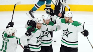 Dec 11, 2021; San Jose, California, USA; Dallas Stars left wing Michael Raffl (18) celebrates with teammates after scoring a goal during the third period against the San Jose Sharks at SAP Center at San Jose. Mandatory Credit: Darren Yamashita-USA TODAY Sports