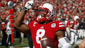 Oct 25, 2014; Lincoln, NE, USA; Nebraska Cornhuskers running back Ameer Abdullah (8) celebrates after scoring a touchdown against Rutgers Scarlet Knights in the second half at Memorial Stadium. Nebraska won 42-24. Mandatory Credit: Bruce Thorson-USA TODAY Sports