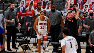 LUBBOCK, TEXAS - DECEMBER 17: Guard Nimari Burnett #25 of the Texas Tech Red Raiders reacts after a made shot by guard Terrence Shannon Jr. #1 during the second half of the college basketball game against the Kansas Jayhawks at United Supermarkets Arena on December 17, 2020 in Lubbock, Texas. (Photo by John E. Moore III/Getty Images)