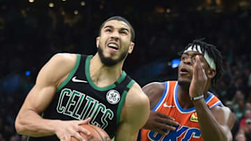 Celtics forward Jayson Tatum (0) controls the ball while OKC Thunder guard Luguentz Dort (5) defends : Bob DeChiara-USA TODAY Sports
